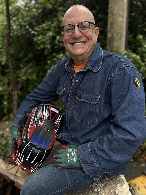 Lloyd Goradesky, international public artist,  posing for WElding photo